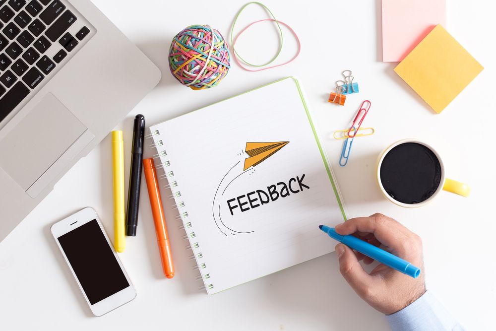 "Feedback" written on a notebook