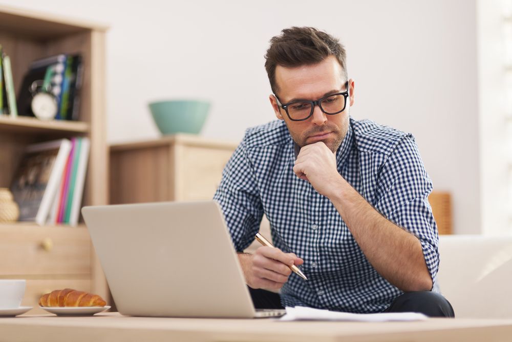 A man working in a living room