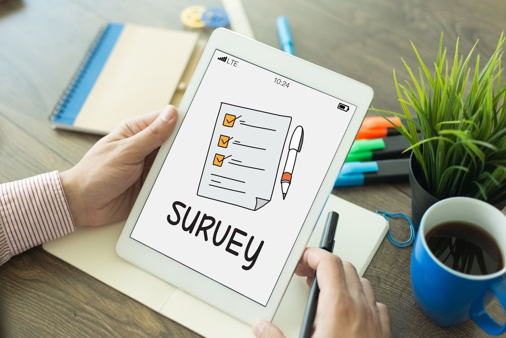 "Survey" flashed on a tablet screen