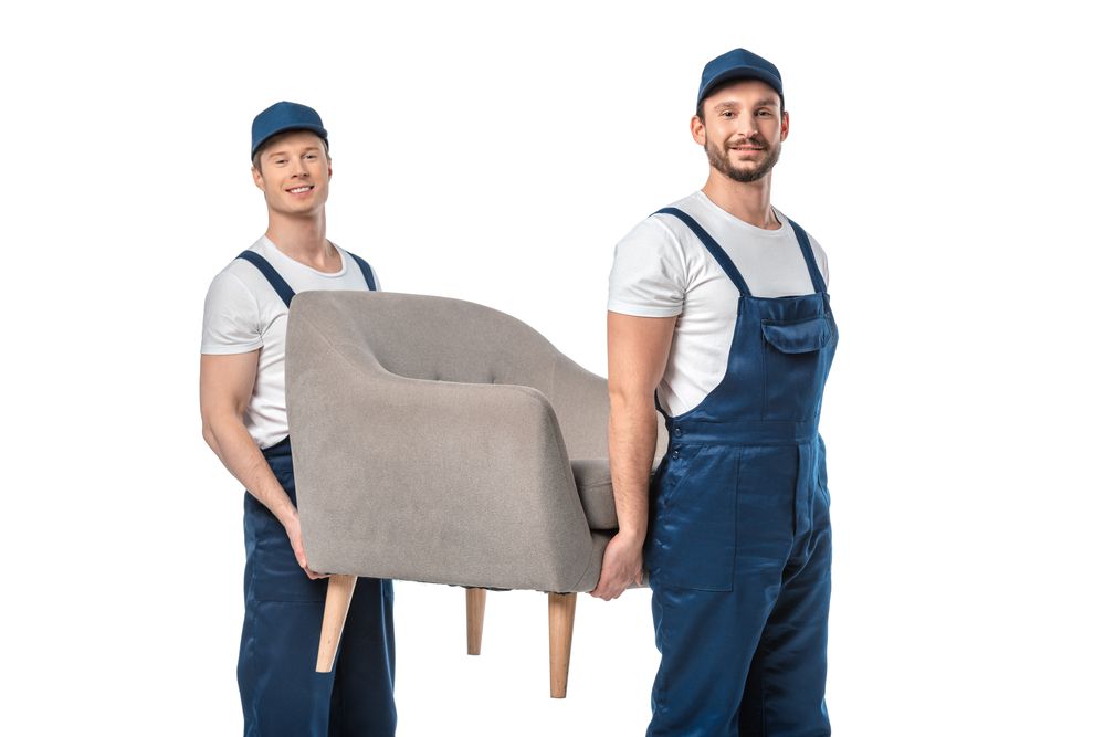 Two men carrying a chair