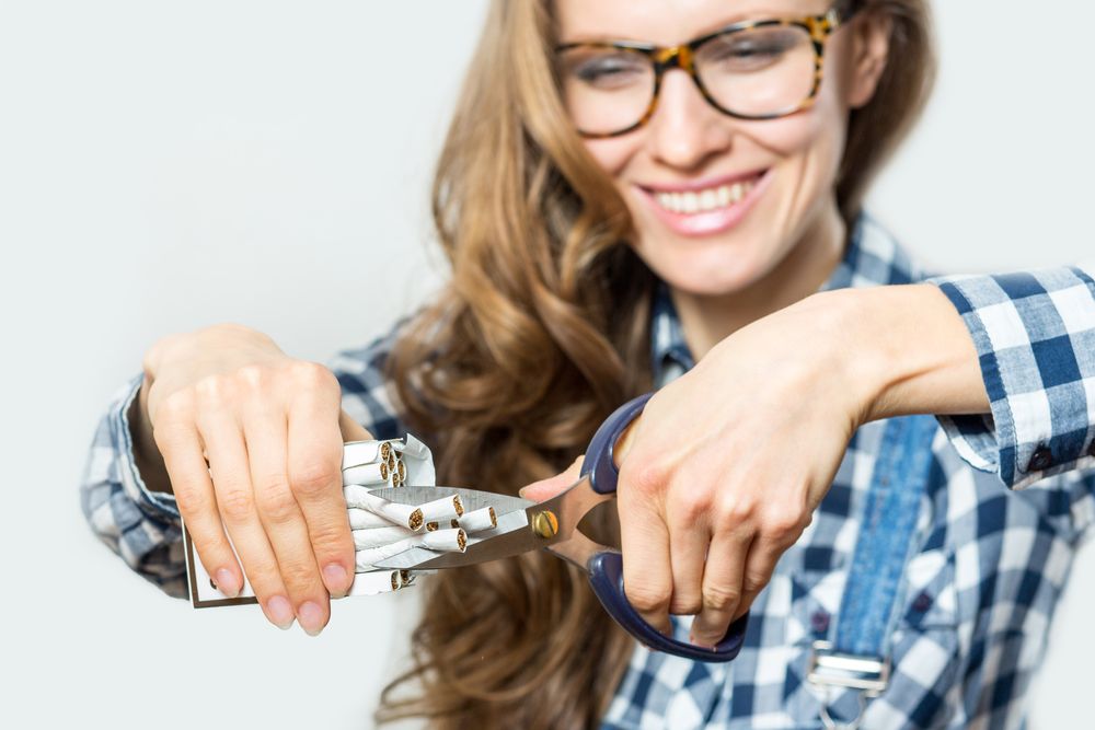 A woman cutting cigarettes