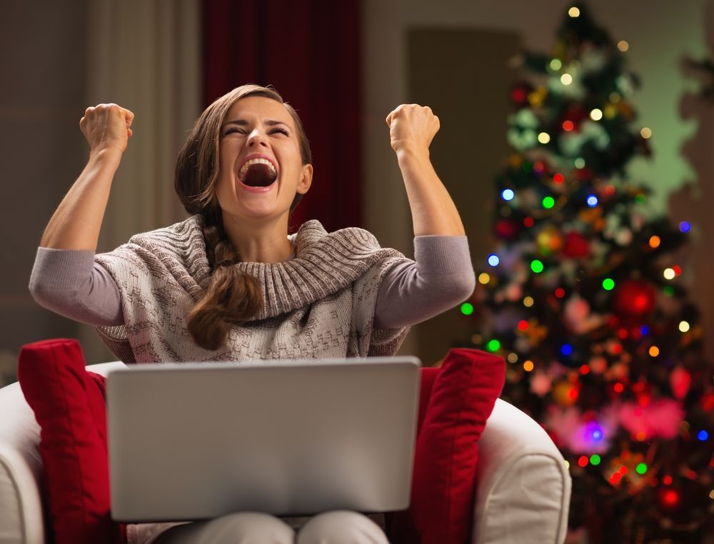 A happy woman on a laptop