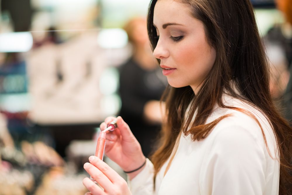 A woman trying out a cosmetic product