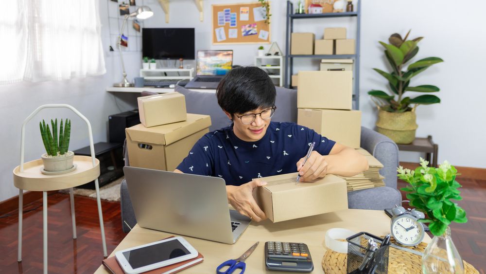 A young man packing orders