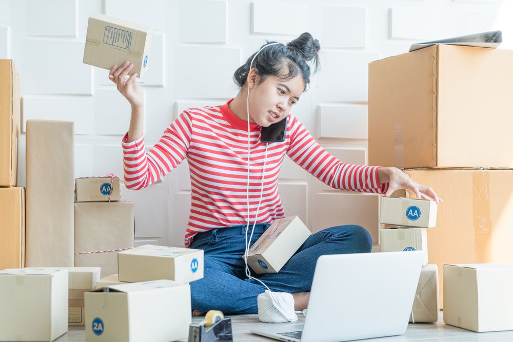 A young woman sorting packages for sale